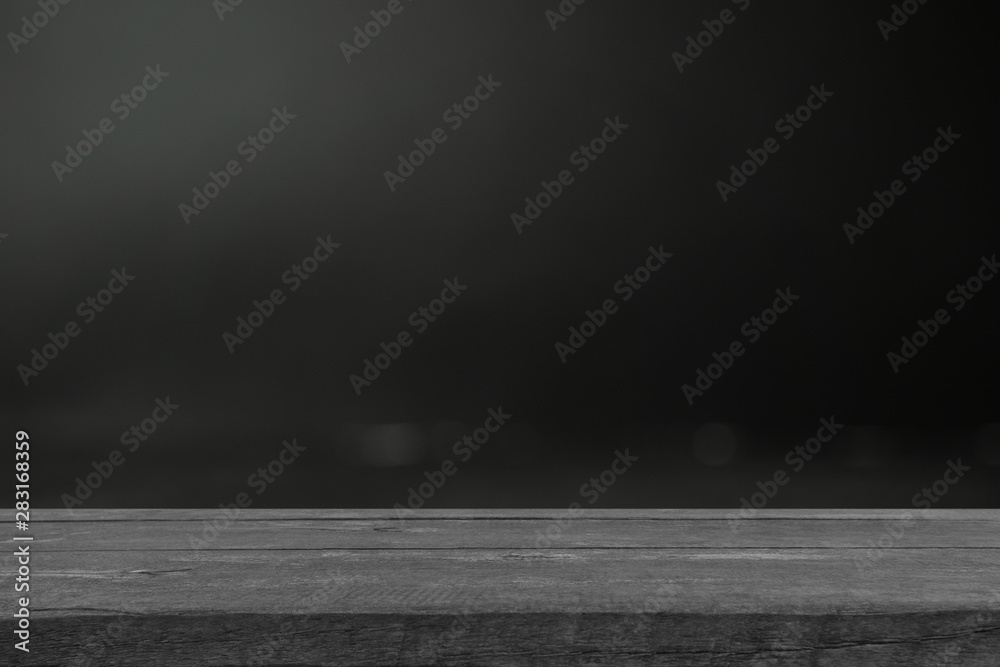 Real dark wood plank desk table top on black background, Can be used for display or montage your products. Real dark wood plank desk table top on black background, Can be used for display or montage your products.