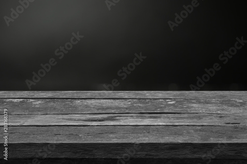 Real dark wood plank desk table top on black background  Can be used for display or montage your products.