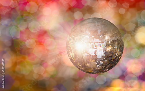 Party disco mirror ball reflecting colorful lights