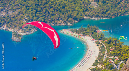 Oludeniz Beach And Blue Lagoon - Paraglider flies in the sky - Fethiye