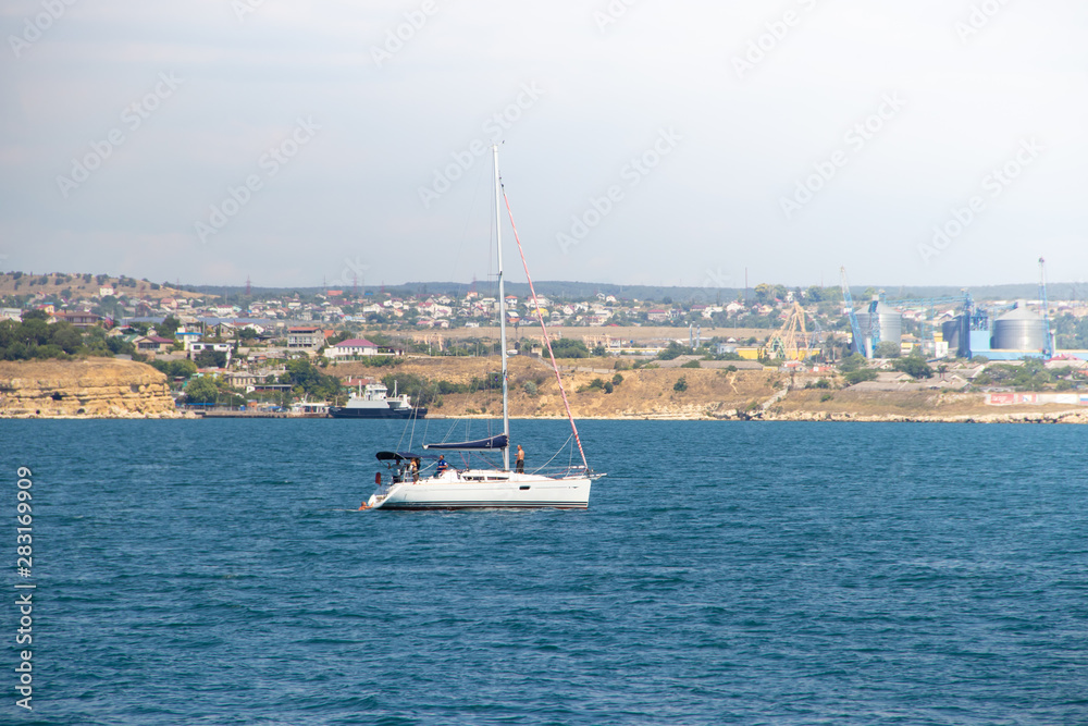 Sevastopol Bay in the summer in sunny weather. Crimea, Russia. A lot of boats and ships. Bay for boats. Sevastopol Bay in the summer in sunny weather. Crimea, Russia. A lot of boats and ships. Bay for boats.