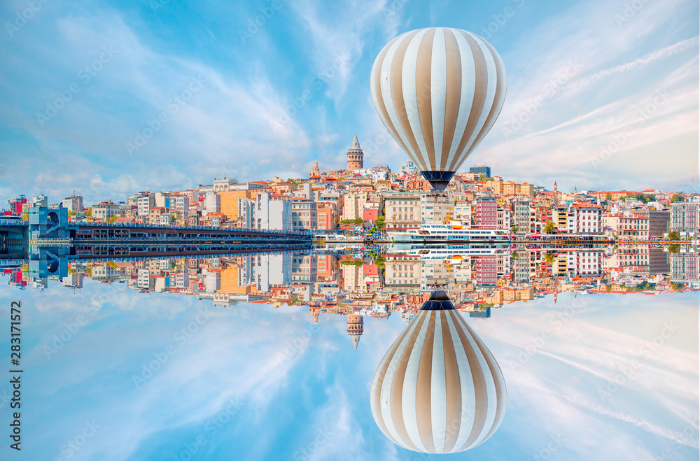 Naklejka premium Hot air balloon flying over Galata tower, istanbul
