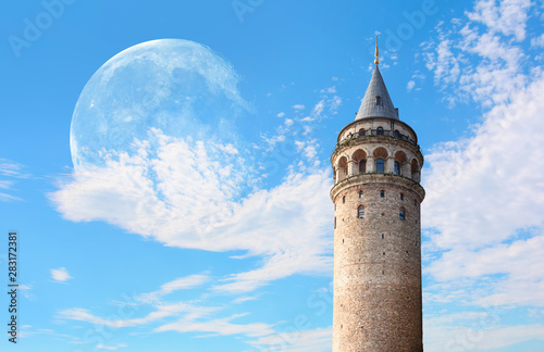 Galata Tower with bright blue sky with full moon - istanbul, Turkey 