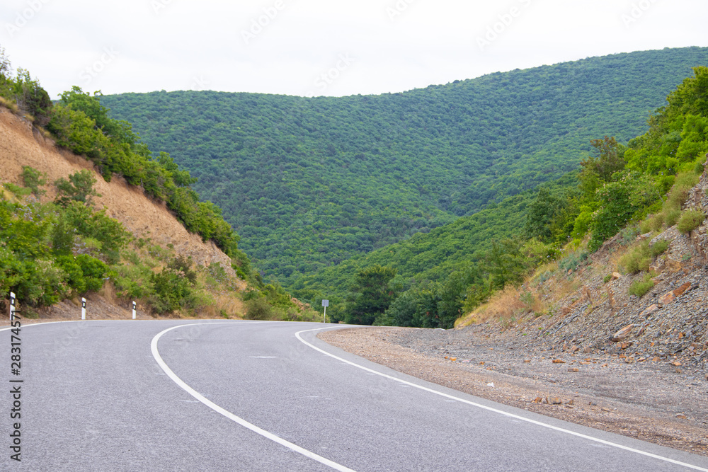 Highway in the mountains. Anapsky district of Russia. The nature is mountainous. low mountains. Turning road Highway in the mountains. Anapsky district of Russia. The nature is mountainous. low mountains. Turning road