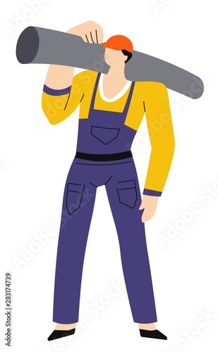 Man in hardhat carrying beam or balk, pipe or tube on shoulder
