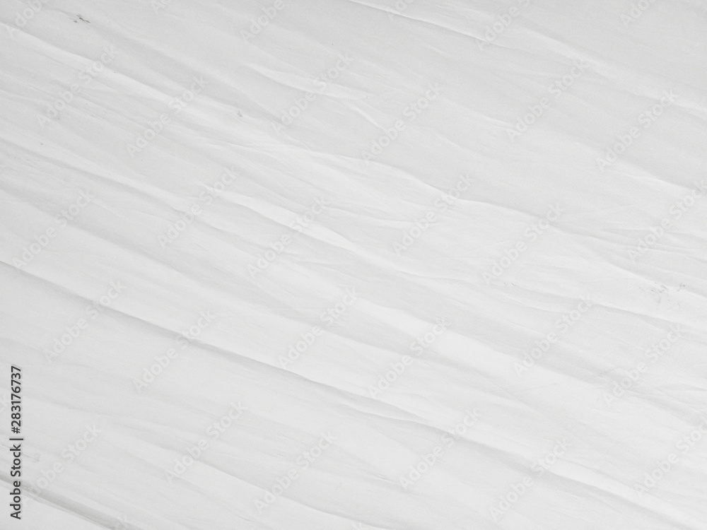 Soft white wrinkled fabric background Soft white wrinkled fabric background