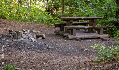 A wood table and a fire pit 