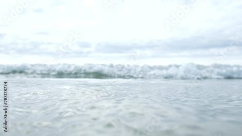 breaking wave approaching the camera, then going over the top of the camera, filmed in 5 x slow motion.