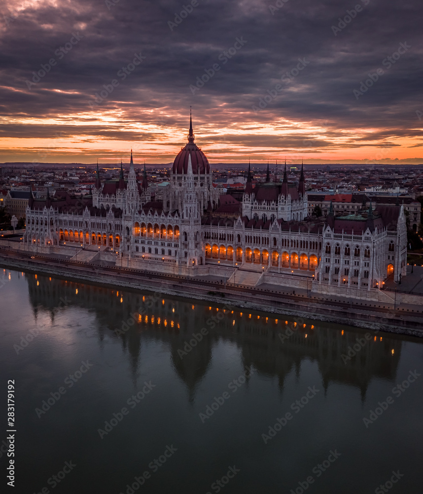 Budapest, Hungary - Aerial panoramic view of the Parliament of Hungary at sunset/sunrise over River Danube and beautiful dramatic purple clouds