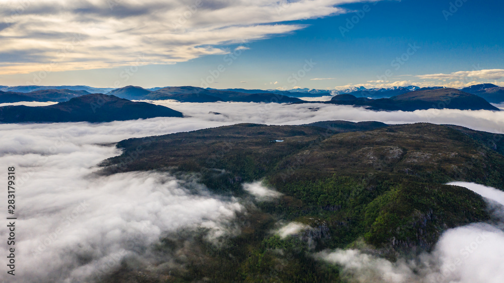 Fish farm at sea. Waterfall. Fjord above the clouds. Aerial view. Norway