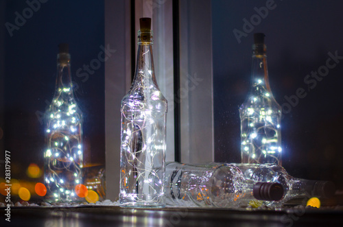 Bokeh light from a lamp in a glass bottle for Christmas, wedding and party decorations