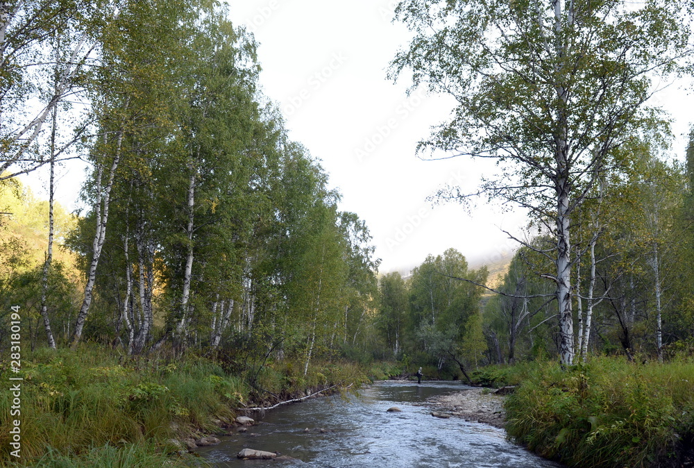 Fishing on the mountain river Yarivka in Western Siberia Fishing on the mountain river Yarivka in Western Siberia