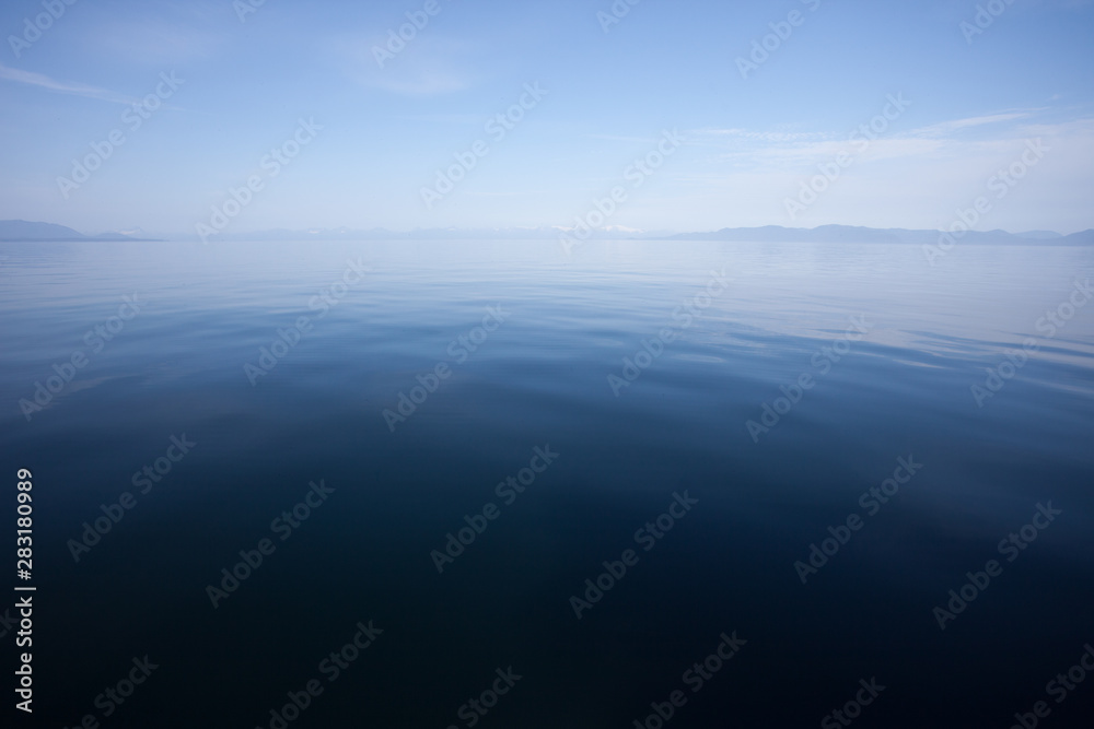 Blue Calm Ocean Water Meets Blue Sky at the Horizon