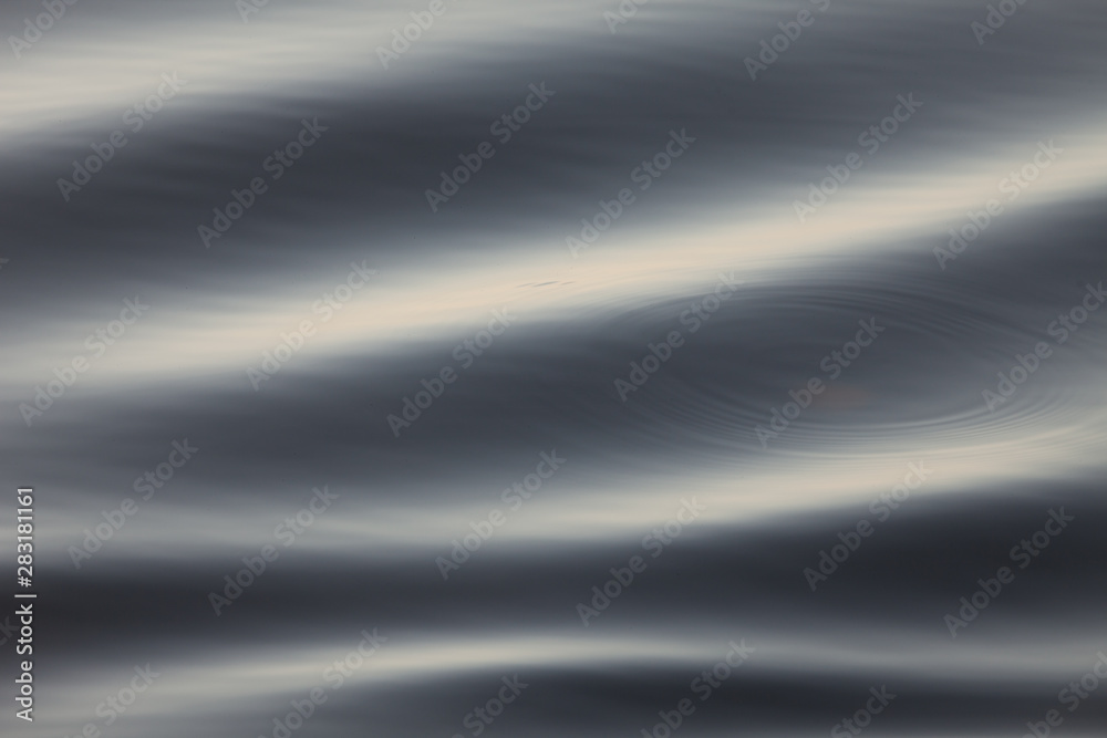 Ripples on blue water background