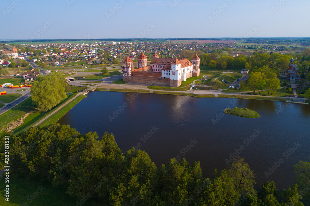 The old Mir Castle in a spring morning landscape (aerial photography). Belarus