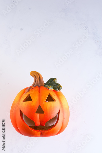 Halloween Pumpkin  funny Jack O Lantern on white murble background  copy space