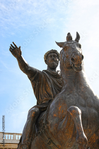 Bronze Roman equestrian statue of Emperor Marcus Aurelius, against the blue sky. Rome, Italy