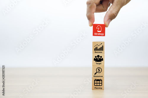 Strategy and planning graphic icons for Business success on wooden blocks