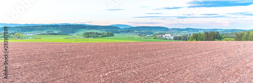 Rural agricultural landscape. Red soil fields around Nova Paka, Czech Republic