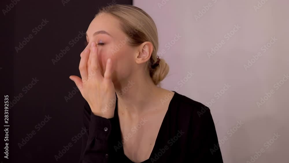 pretty caucasian girl applying professional makeup. beautiful woman applying cosmetic. Tutorial make up fashion industry salon internet courses pretty caucasian girl applying professional makeup. beautiful woman applying cosmetic. Tutorial make up fashion industry salon internet courses