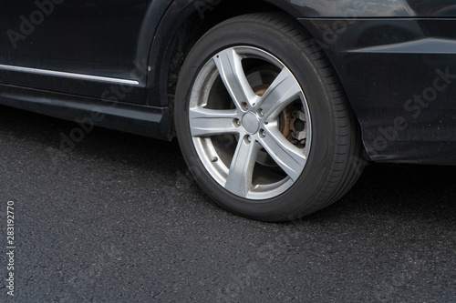  Close-up of a wheel of a black car in movement