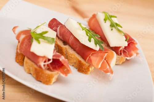 perfect sandwich made with rye bread cheese and Parma ham