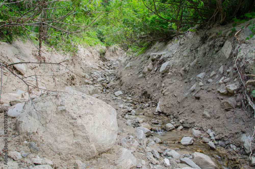 Debris in riverbed after mudflow. Debris in riverbed after mudflow.