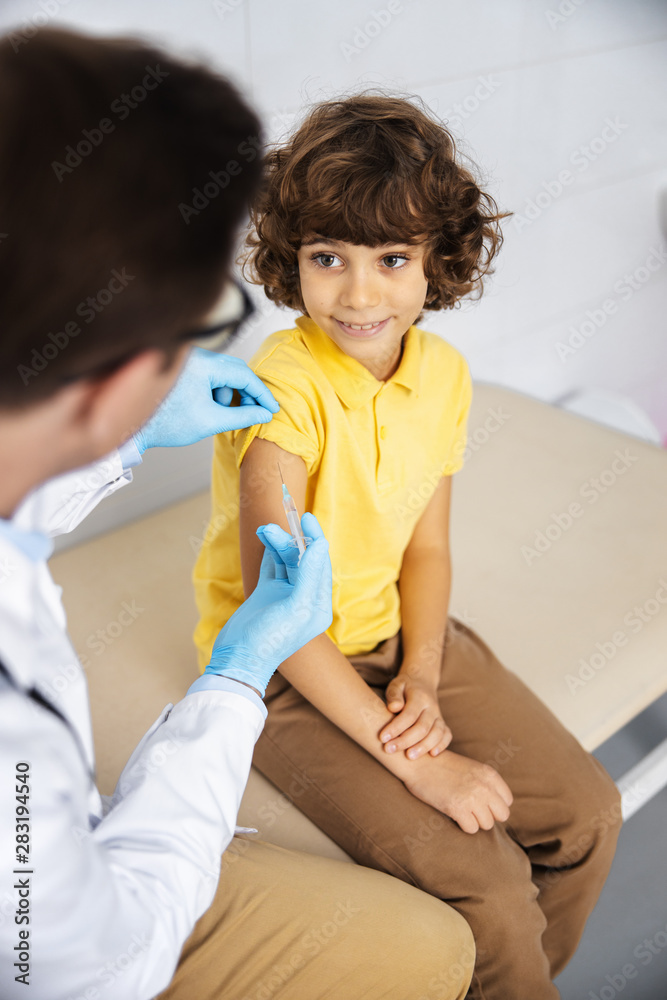 Joyful boy ready for vaccination stock photo Joyful boy ready for vaccination stock photo