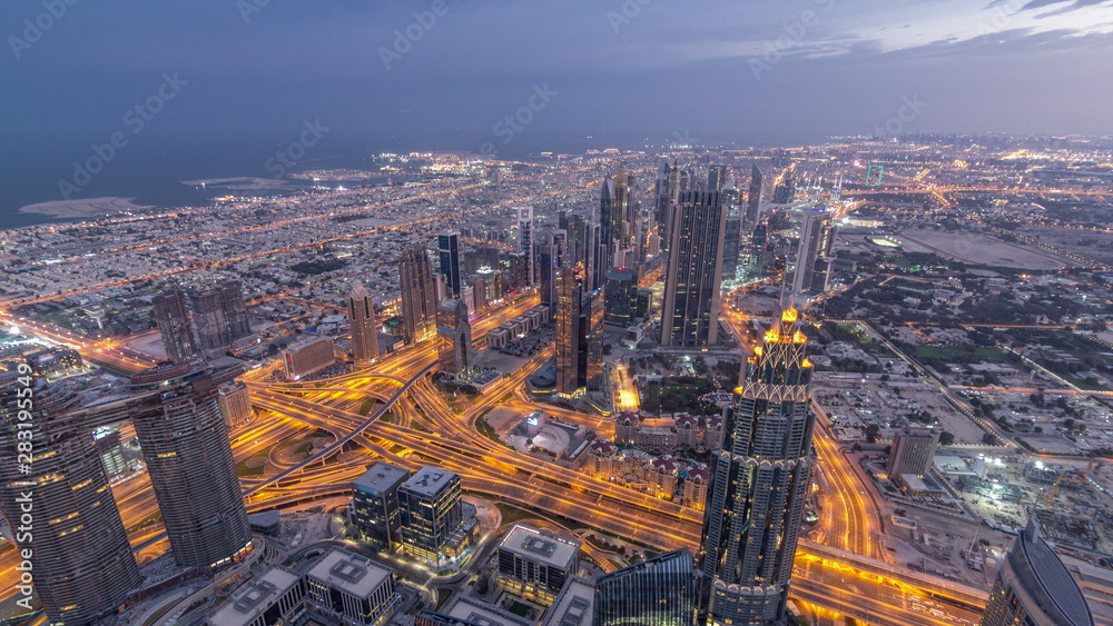 Downtown of Dubai night timelapse before sunrise. Aerial view with towers and skyscrapers