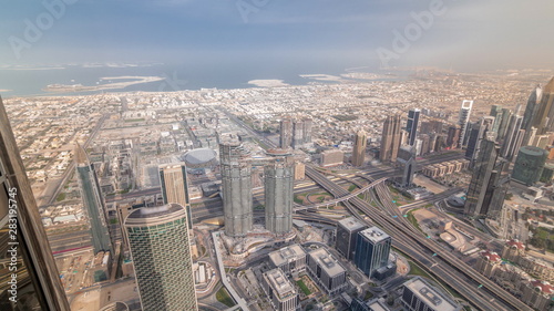 Downtown of Dubai in the morning timelapse after sunrise. Aerial view with towers and skyscrapers © neiezhmakov