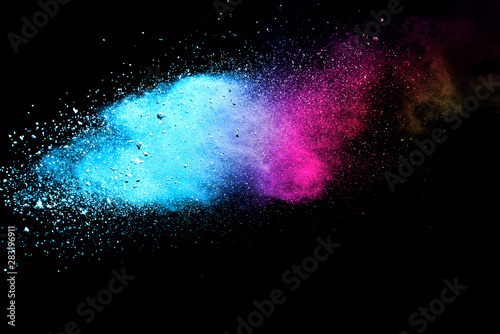 Explosion of colored powder isolated on black background. Abstract colored background. holi festival.