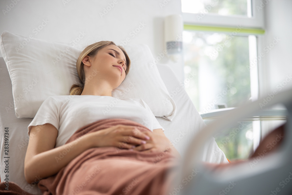 Beautiful young woman sleeping in hospital room Beautiful young woman sleeping in hospital room