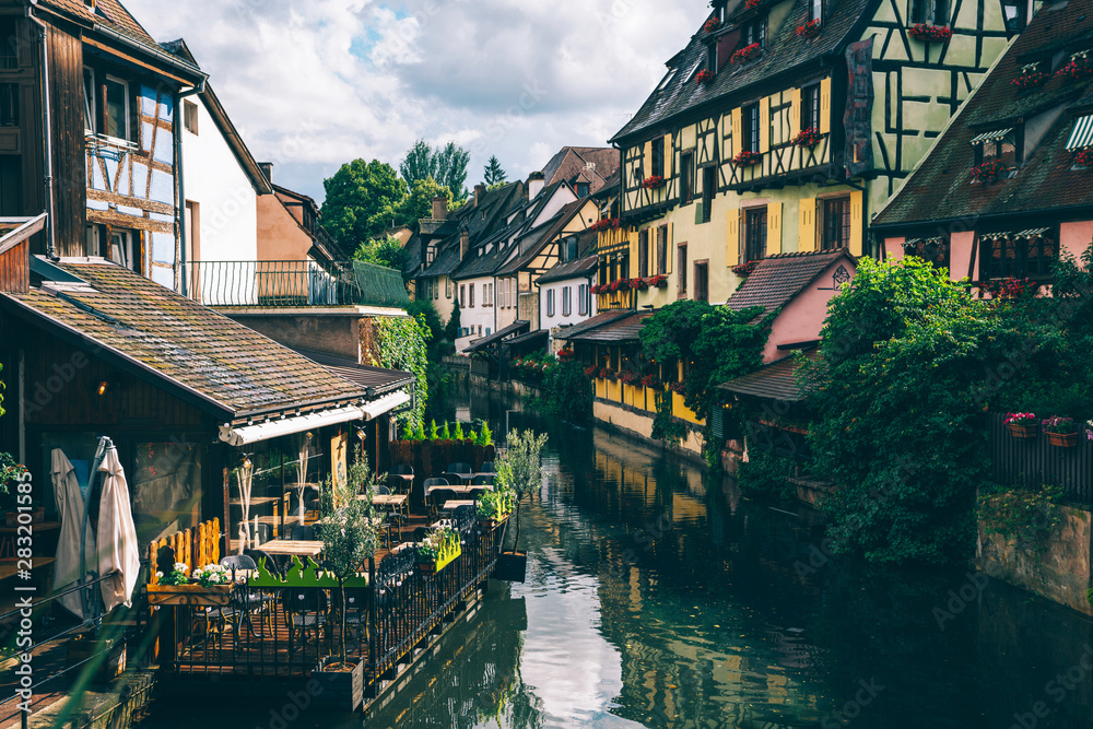 Traditional Alsatian half-timbered houses city Colmar in Alsace. Canal of Colmar, most famous town of Alsace at spring day, France