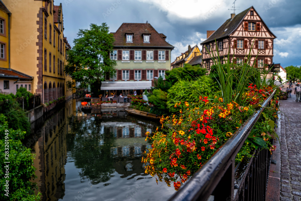 Cityscaspe view on the old town with beautiful half-timbered houses and crowded streets in Colmar, famous french town in Alsace region.