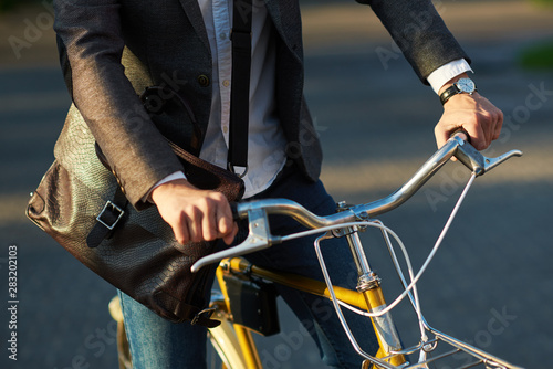 Closeup of businessman Hands with arms clock. Bike Maintenance and Sport Shop Concept