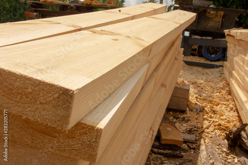 processed boards at a sawmill. Smooth, turned, polished boards at a wood processing plant.