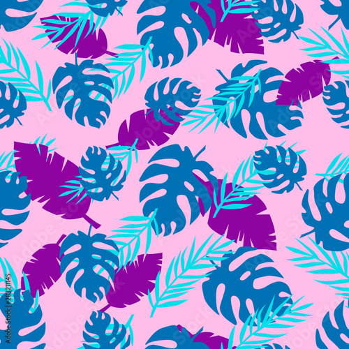 Tropical seamless pattern with bright leaves of monstera and palm trees.