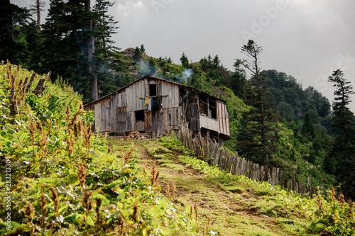 Old wooden house in the georgian mountains photo