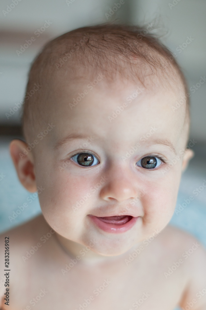 Portrait of adorable smiling baby.