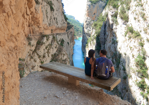 young couple in Montfalcó hiking trail in Huesca, Spain photo