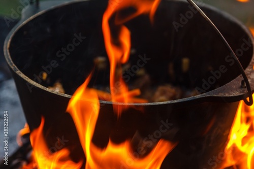 Bowler cooking food bonfire cauldron,  rest.