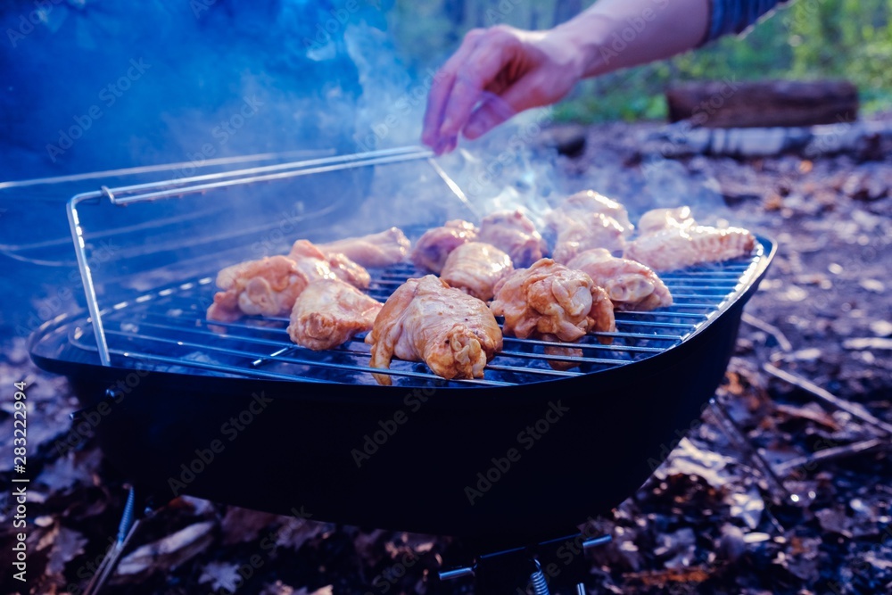 Barbecue chicken wings grilling fire,  hot.