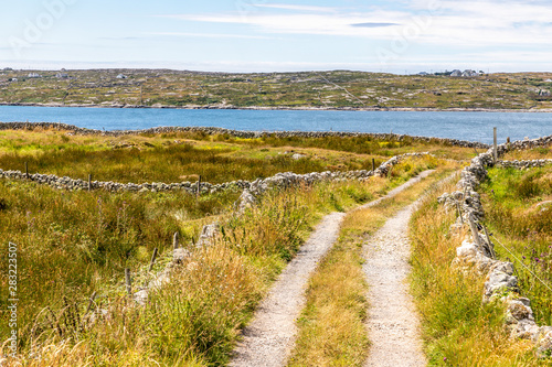 Road with bay and mountains in Carraroe photo