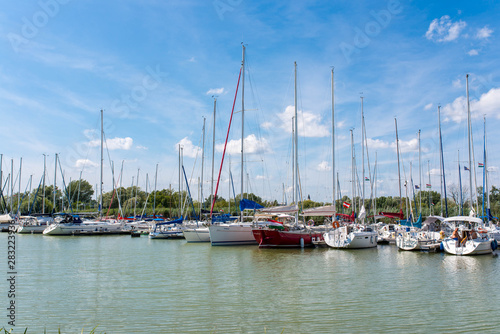 Sailing boats parking in the harbour on a hot summer day. © Alpar