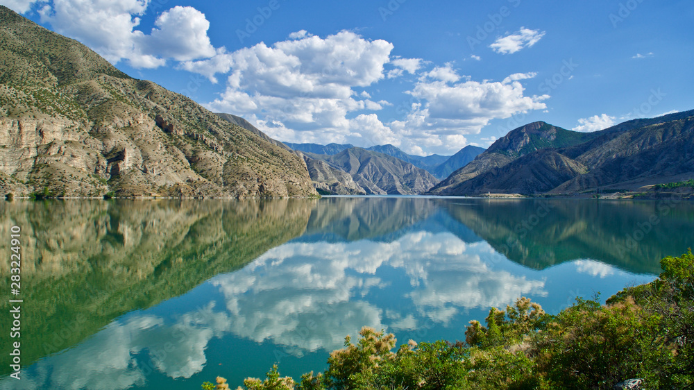 Erzurum, Tortum lake, cliff mountains and cloud reflection in water