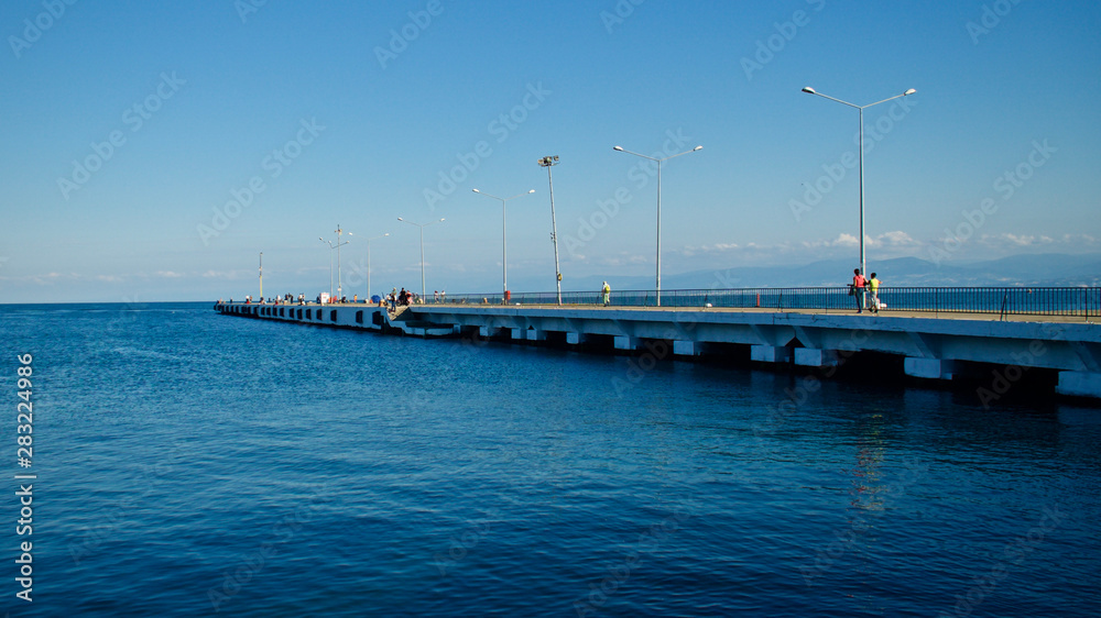 Sinop harbor, pier and strollers