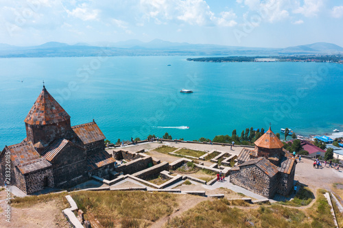 Fototapeta Naklejka Na Ścianę i Meble -  old Sevanavank monastery on the shore of lake Sevan in Armenia. in summer on a clear Sunny day. photography from the quadrocopter. the view from the top