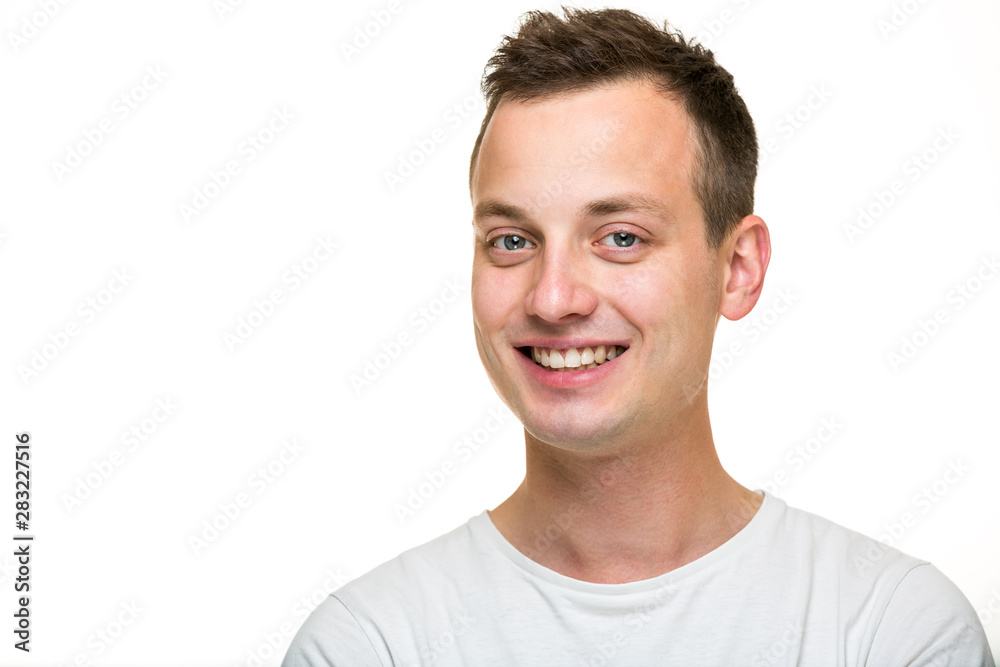 Portrait of a handsome young man on grey background Portrait of a handsome young man on grey background