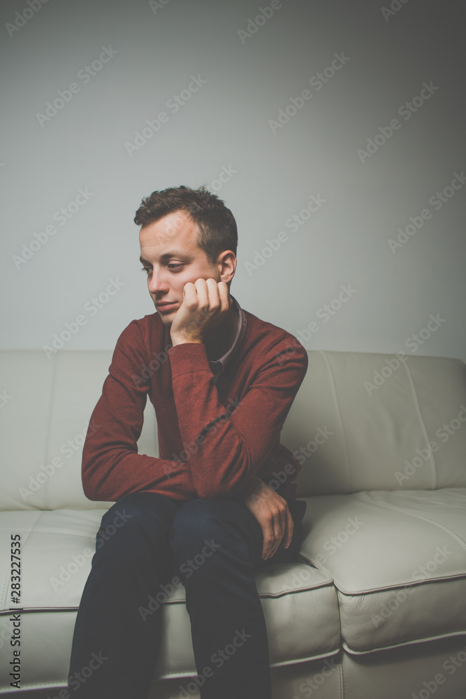 Depressed young man going through a rough patch in his life - suffering from mental exhaustion/anxiety/burnout/depression (color toned image) Depressed young man going through a rough patch in his life - suffering from mental exhaustion/anxiety/burnout/depression (color toned image)