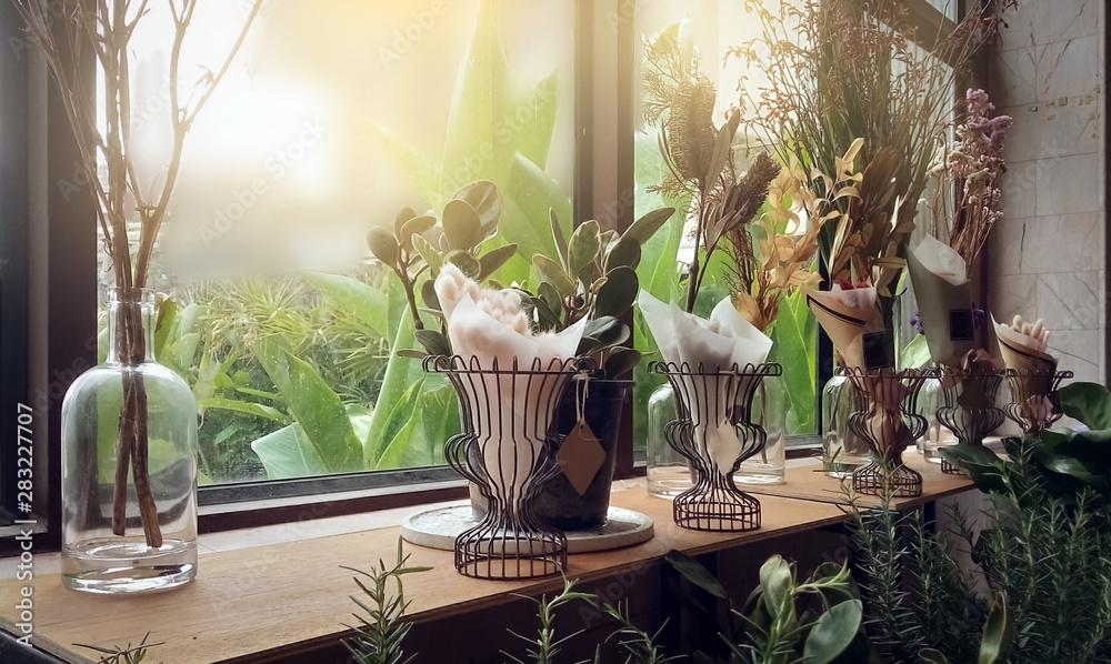 Fototapeta premium Display of dry flower and dry leaf on old wooden table. display on vintage style